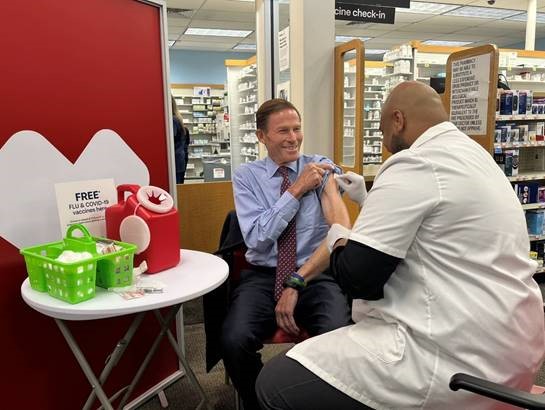 Blumenthal received a new COVID-19 vaccine and a flu shot while encouraging others to get vaccinated ahead of the winter and holiday season.